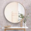 Big,Round,Mirror,,Table,With,Jewelry,And,Decor,Near,Brick