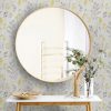 Big,Round,Mirror,,Table,With,Jewelry,And,Decor,Near,Brick