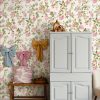 White,Dresser,With,Bows,Hanging,On,The,Wall,And,Straw